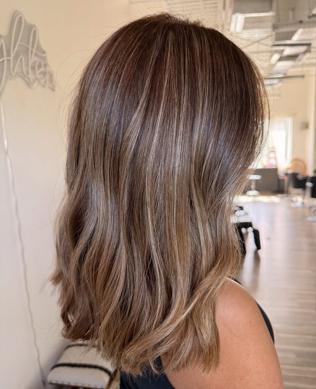 Warm Bronde Balayage On Wavy Collarbone Cut