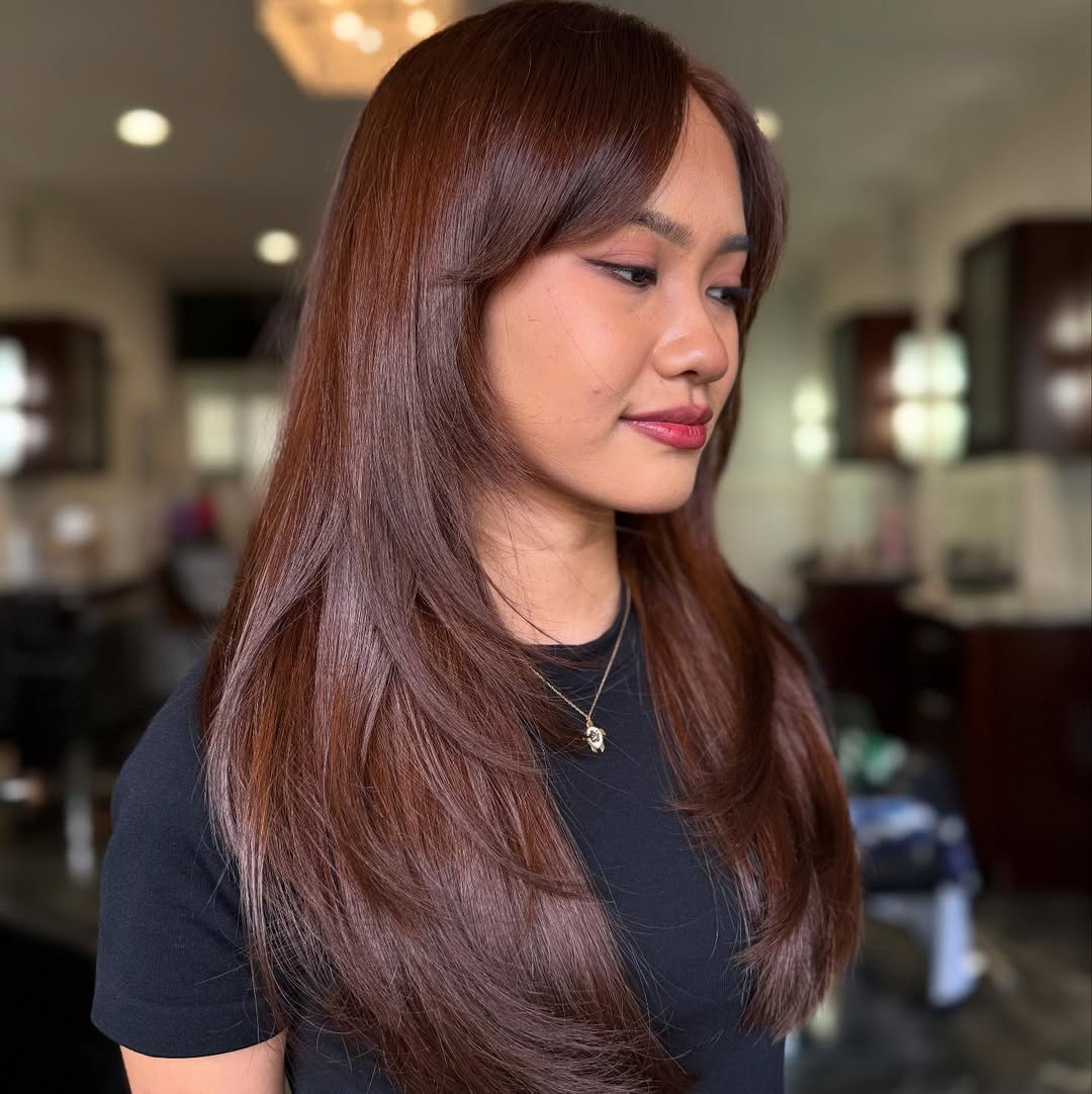 Warm Chestnut Layers With Face-Framing Bangs