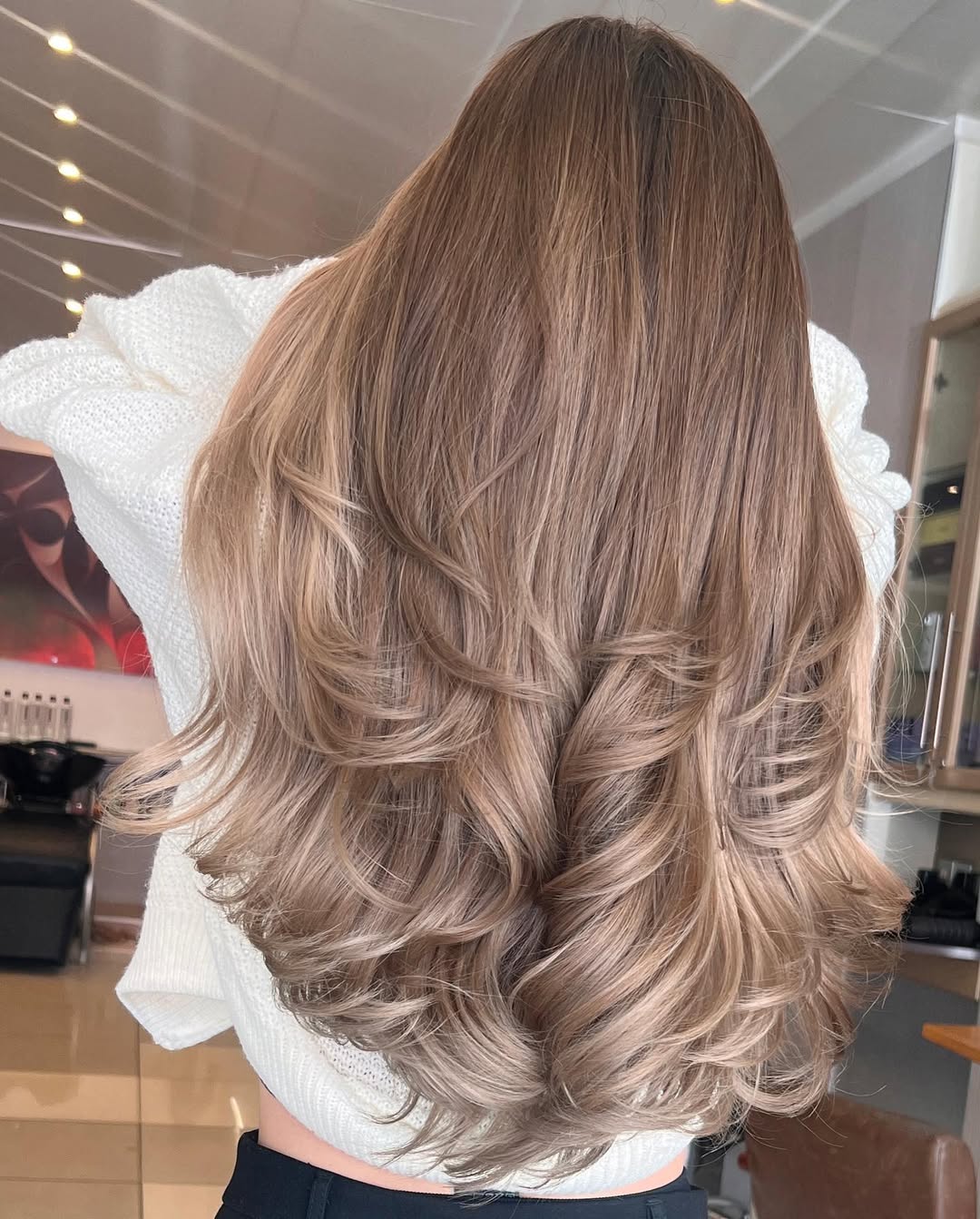 Warm Honey Blonde Curtain Bangs With Soft Waves