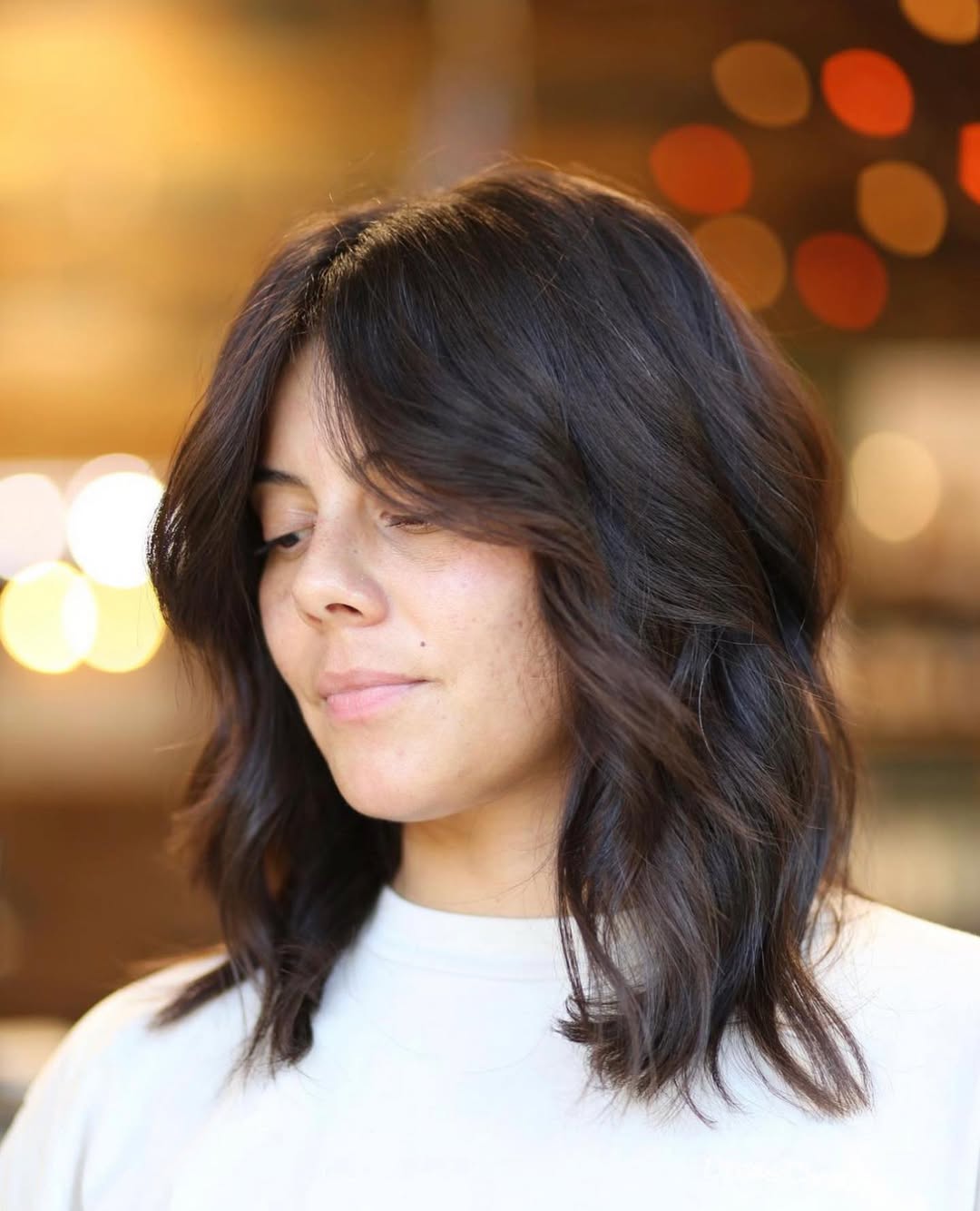 Wavy Collarbone Cut With Soft Curtain Bangs
