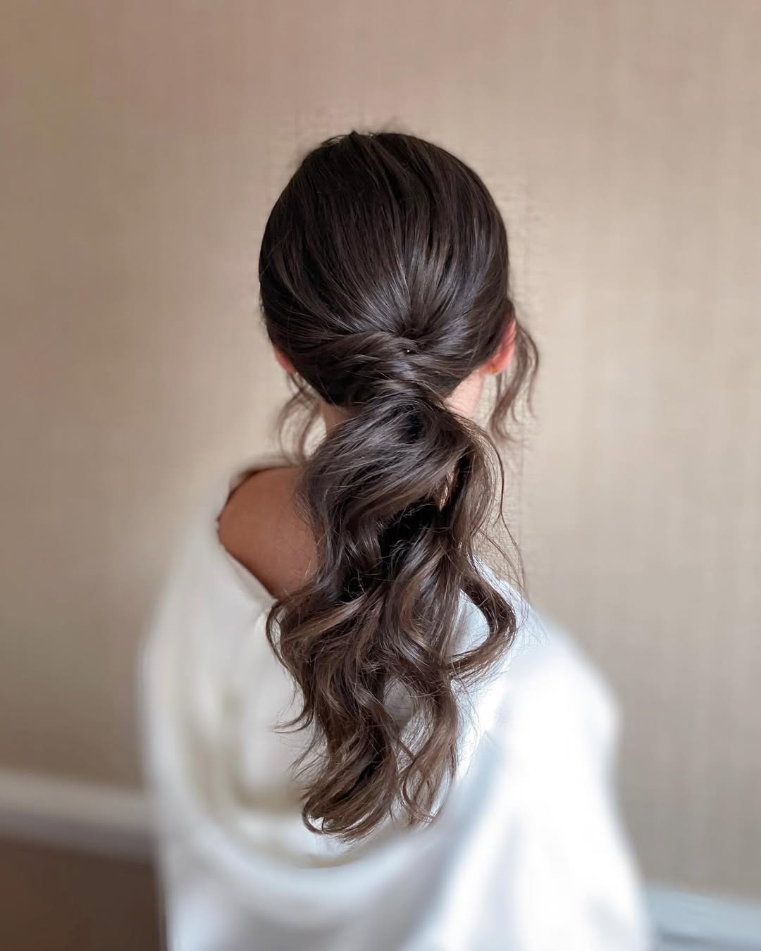 Wavy Low Ponytail With Voluminous Crown