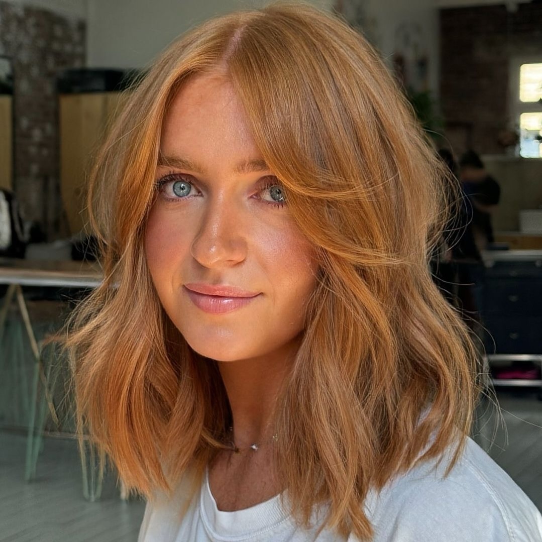 Wavy Strawberry Blonde Lob With Layered Bangs