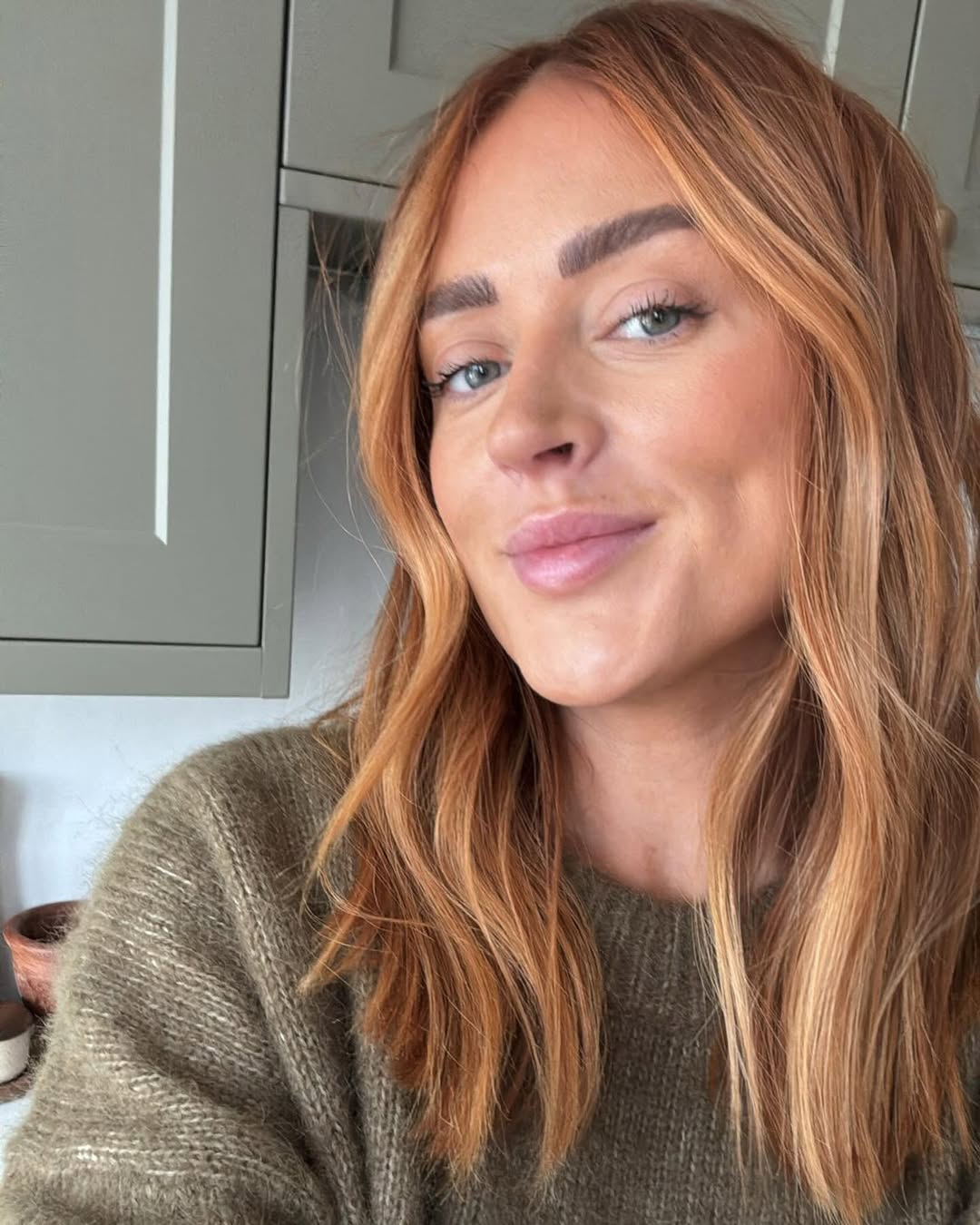 Wavy Strawberry Blonde With Sunny Highlights