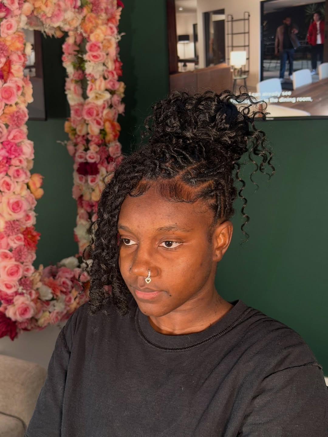 Whimsical Loc Bun With Face-Framing Tendrils