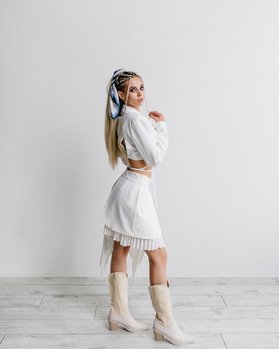 White Cut-Out Blazer And Pleated Skirt Ensemble