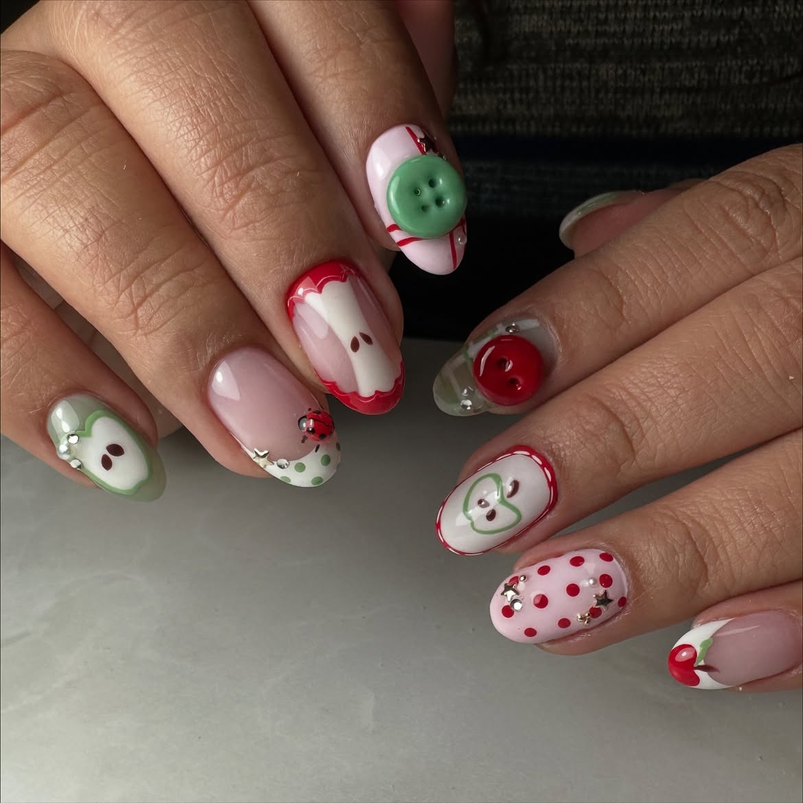 Apple Themed French Tip Nails with Buttons