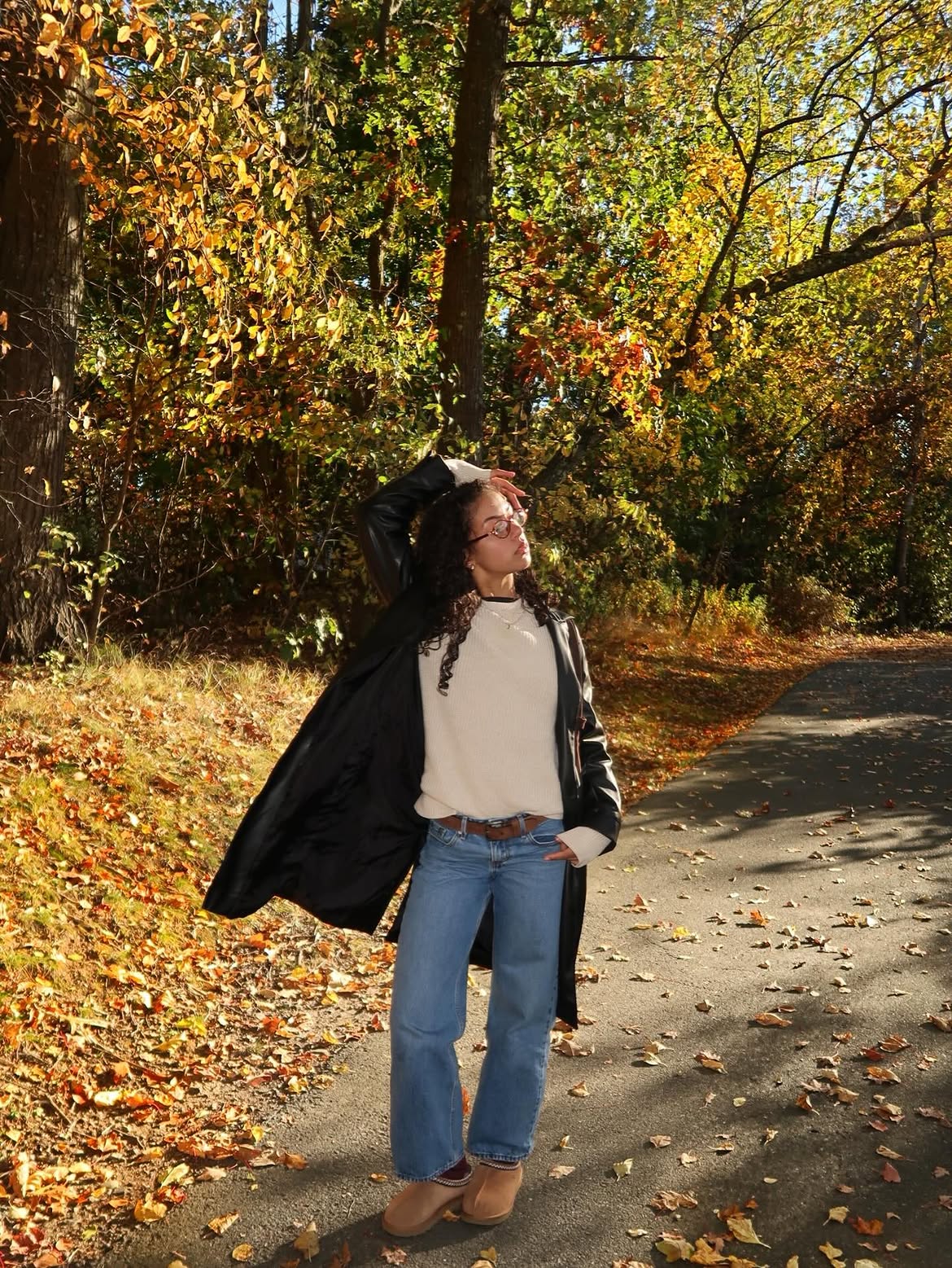 Black Faux Leather Trench, Cream Knit, And Jeans