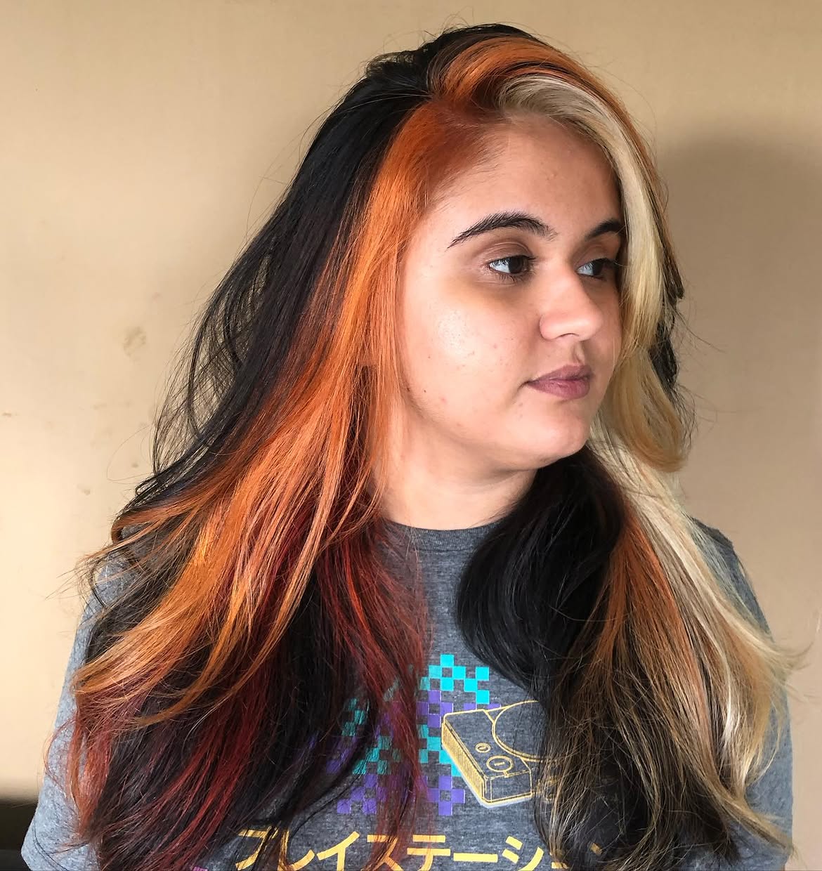 Bold Color Block Hair with Fiery Orange Streaks