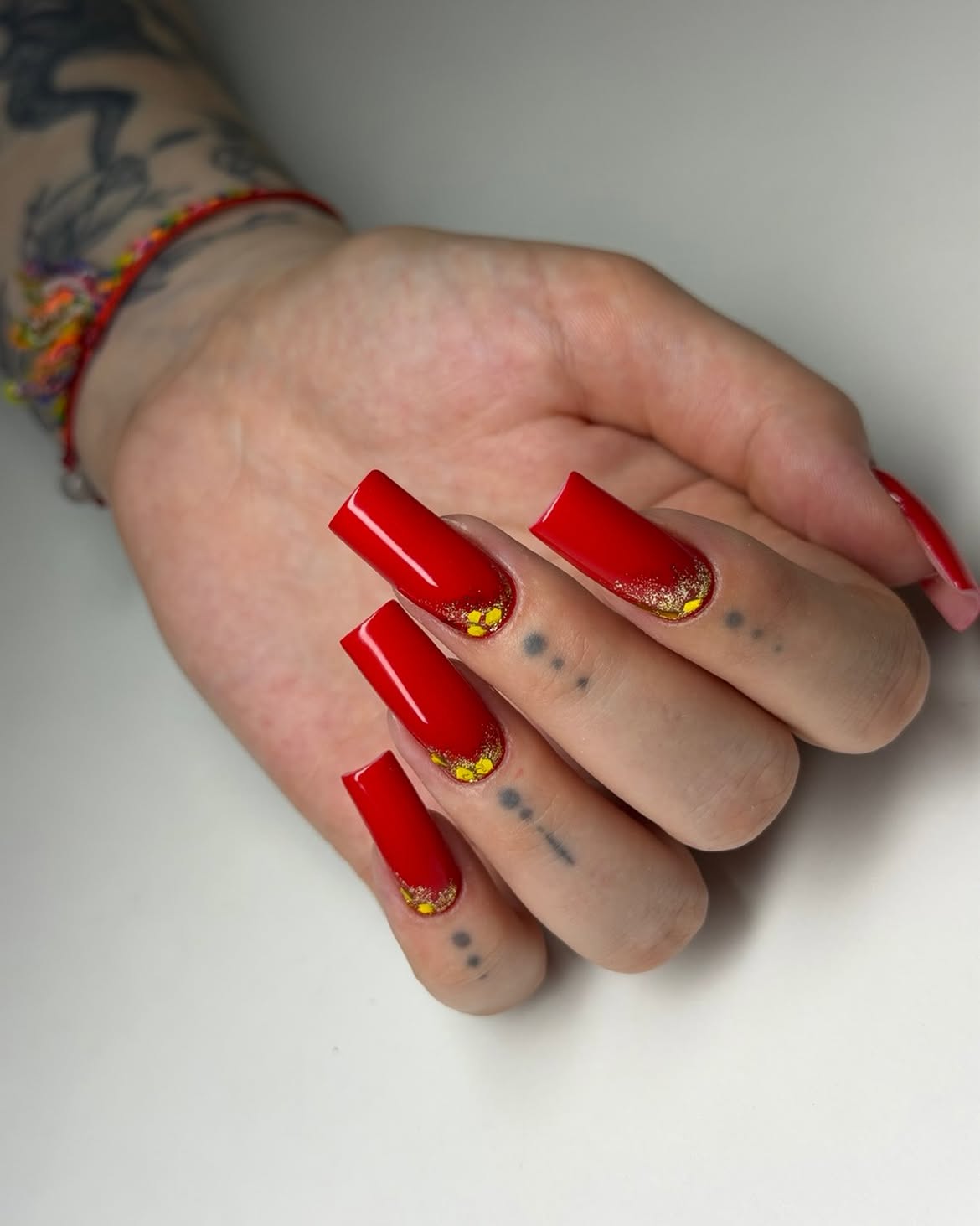 28 Stunning Coffin Nail Ideas for Your Perfect Fall Look 25 Bold Red Coffin Nails with Gold Foil Accents