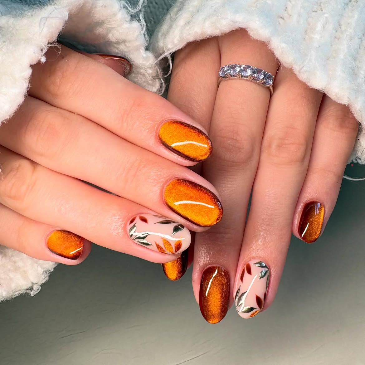 28 Stunning Orange Fall Nail Ideas You Need to Try 11 Burnt Orange Cat Eye Fall Leaf Accent Nails