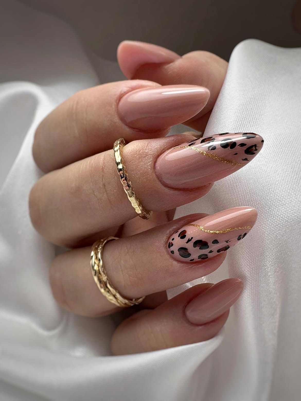 Chic Leopard Print Almond Nails with Gold Accent