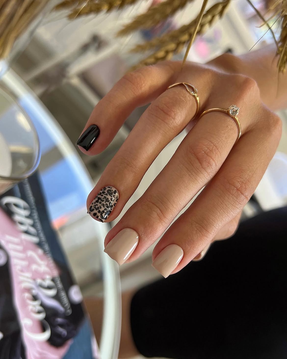 Chic Mismatched Leopard and Black Nails