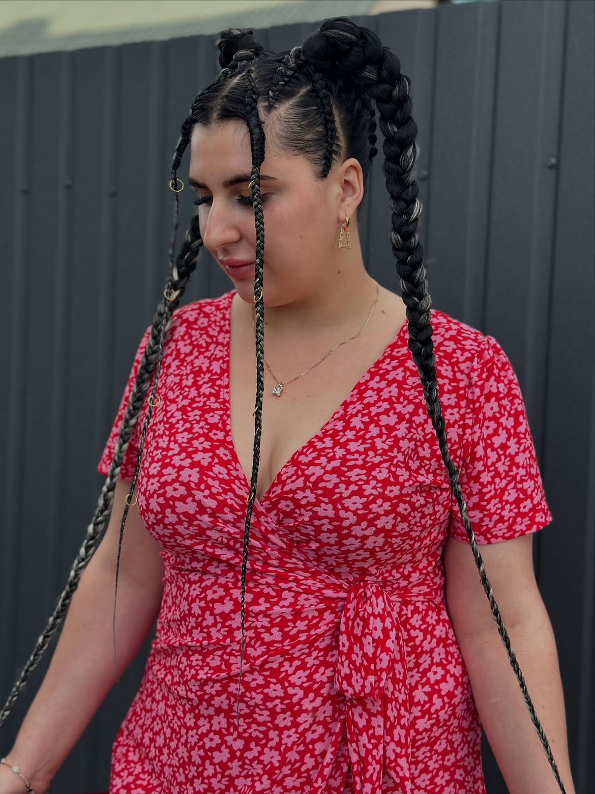 Chunky Braids With Double Buns And Gold Rings