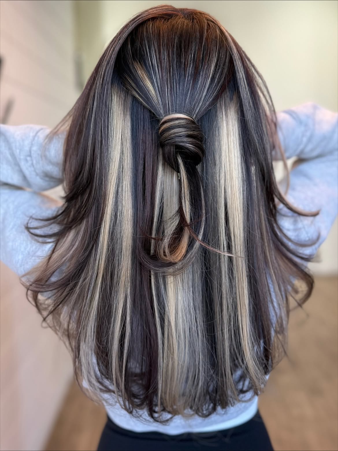 Contrasting Streaks With Twisted Half-Up Detail