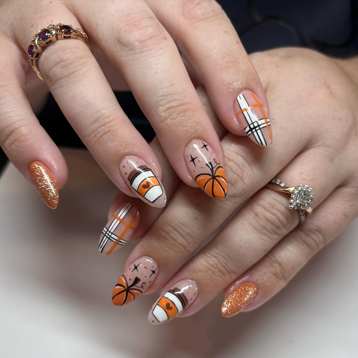 28 Stunning Pumpkin Nail Ideas for a Chic Fall Look 8 Cozy Autumn Pumpkin Spice Coffee Nails
