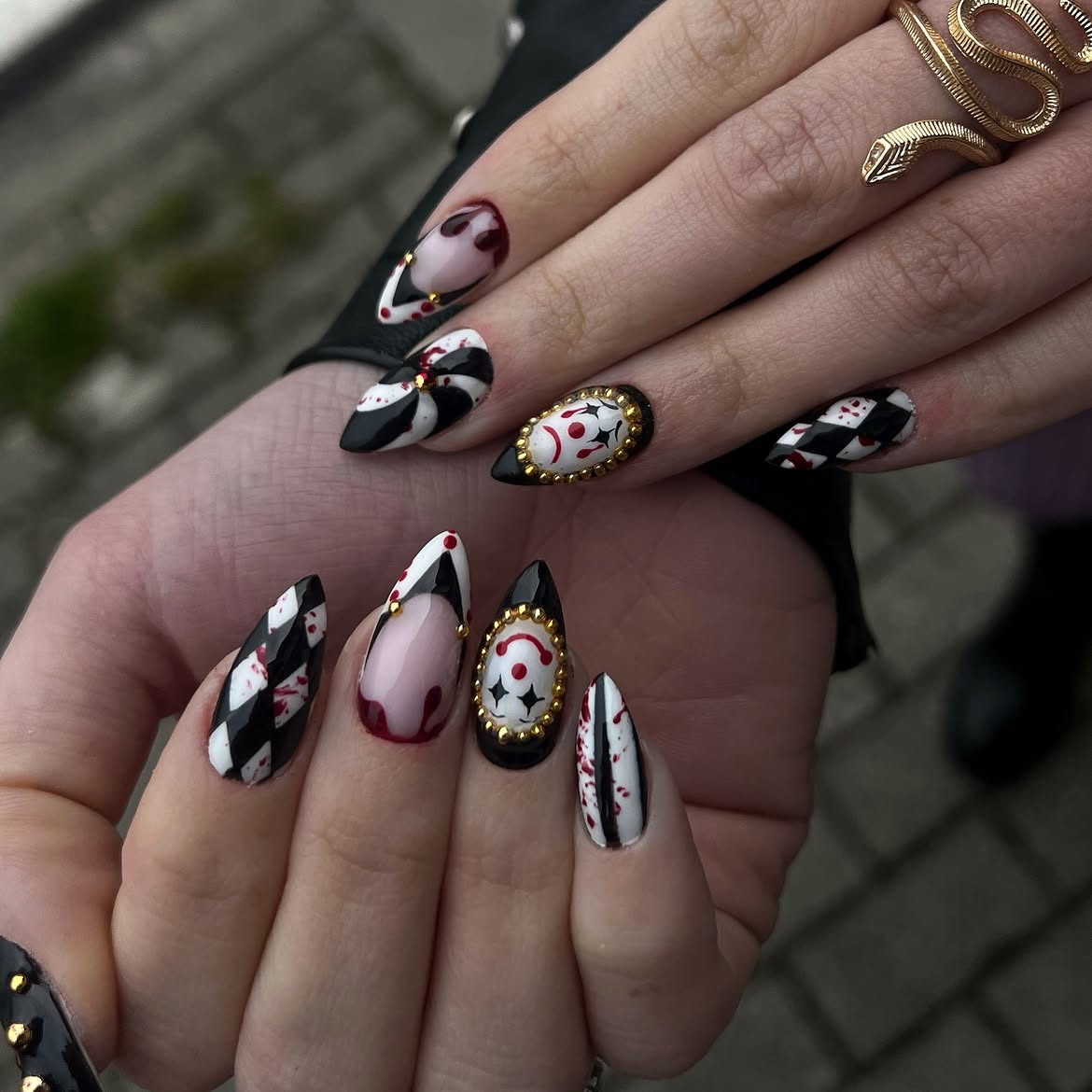 28 Spooktacular Halloween Nail Ideas You Need To Try 18 Creepy Clown Charms & Bloody Court Jester Nails