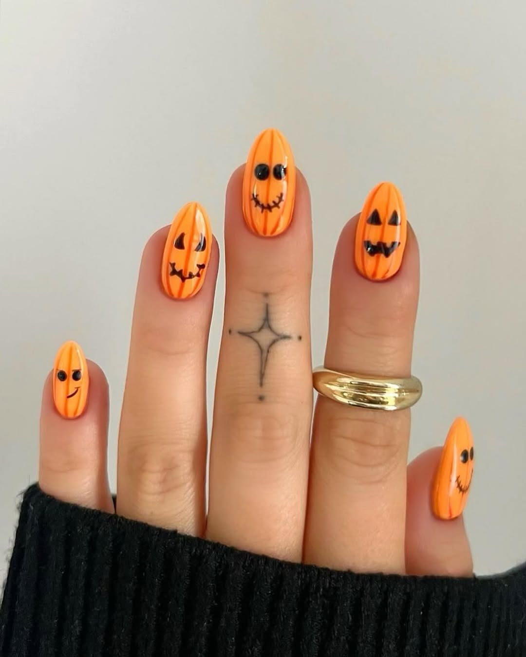 28 Stunning Pumpkin Nail Ideas for a Chic Fall Look 12 Cute Pumpkin Face Halloween Almond Nails