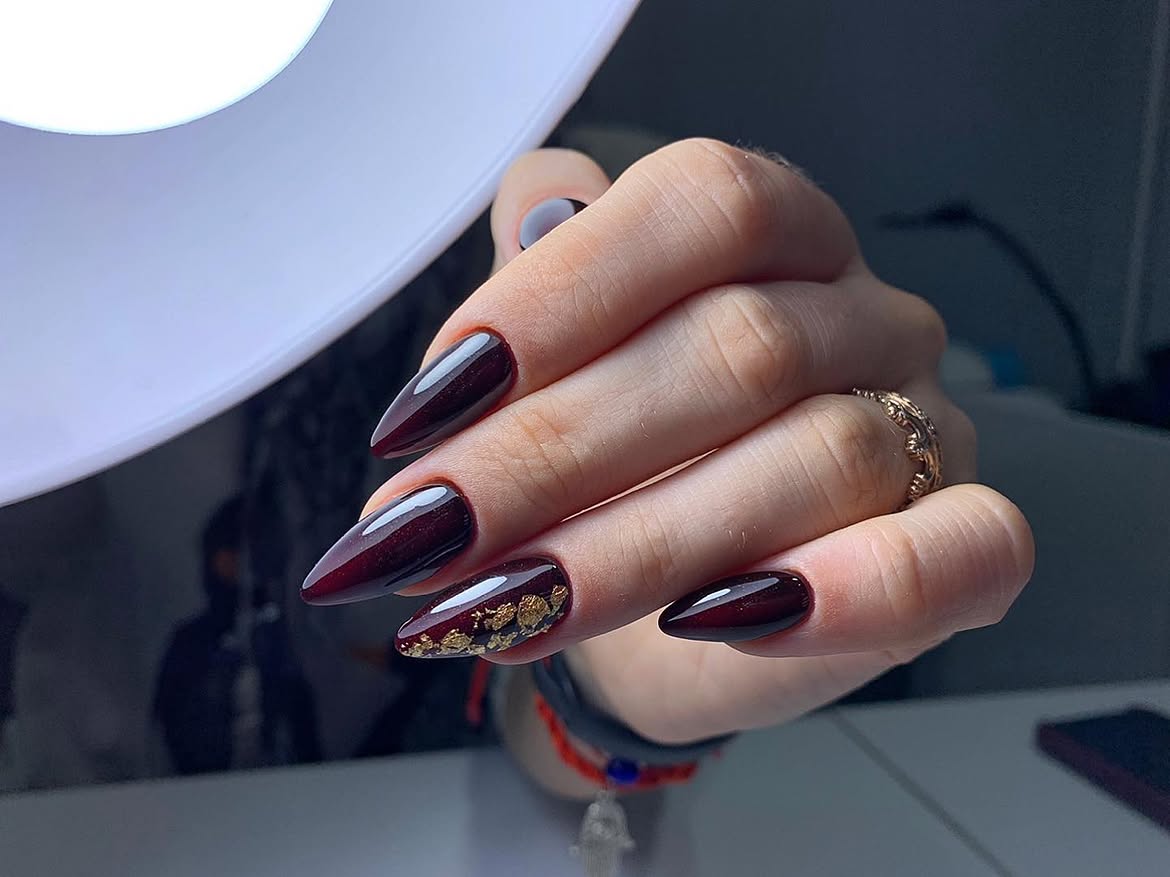 Deep Burgundy Stiletto Nails with Gold Foil Accents