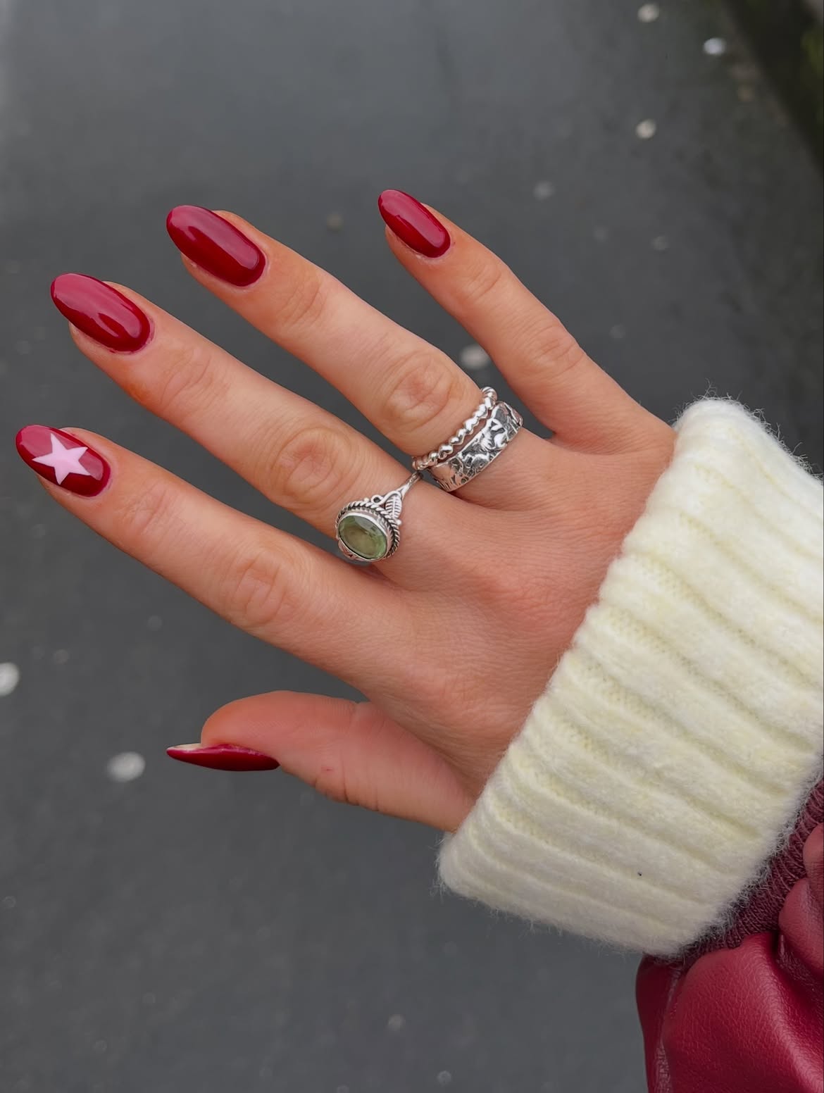 Deep Red Oval Nails with White Star Accent