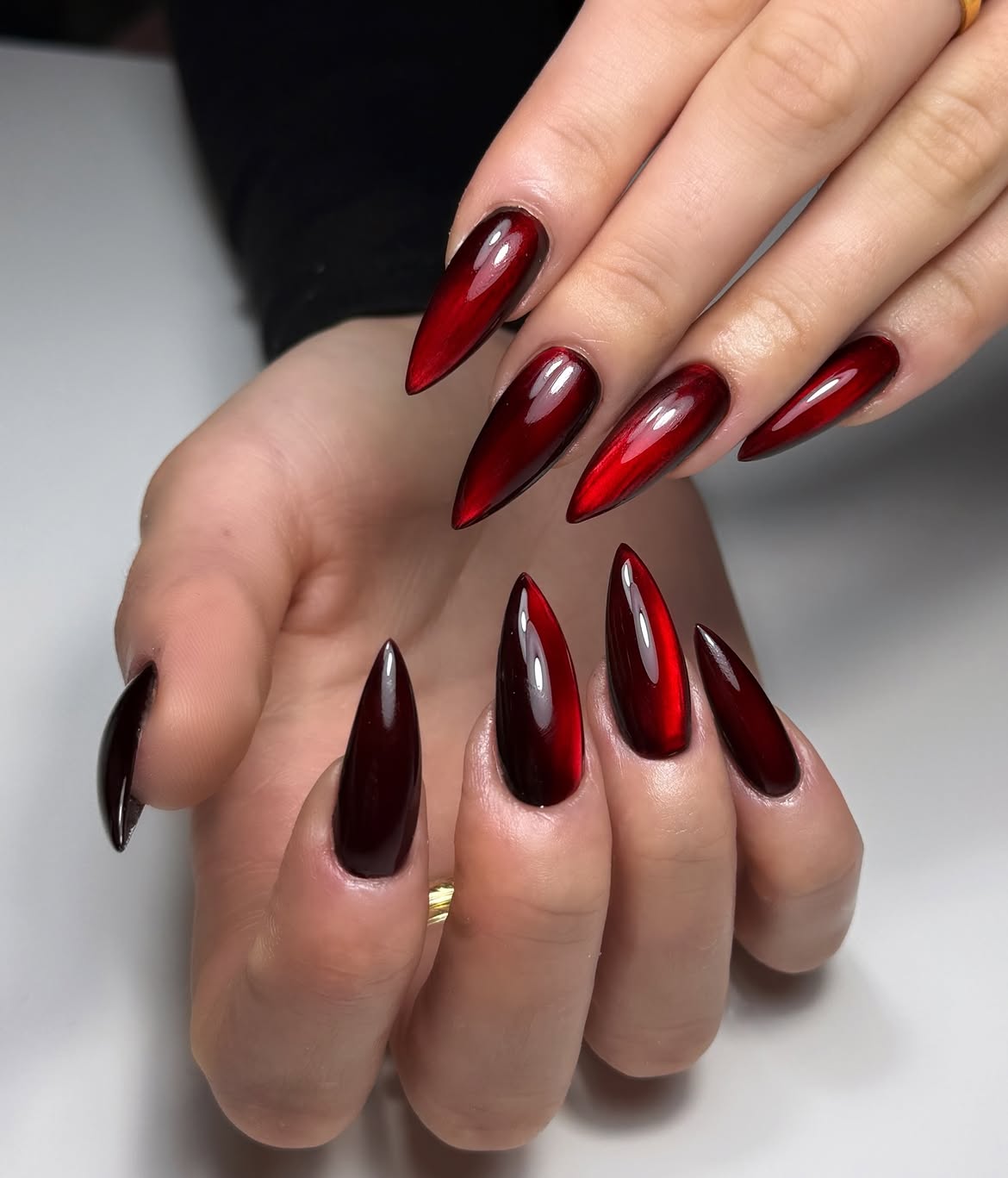 Dramatic Deep Red Cat Eye Stiletto Nails