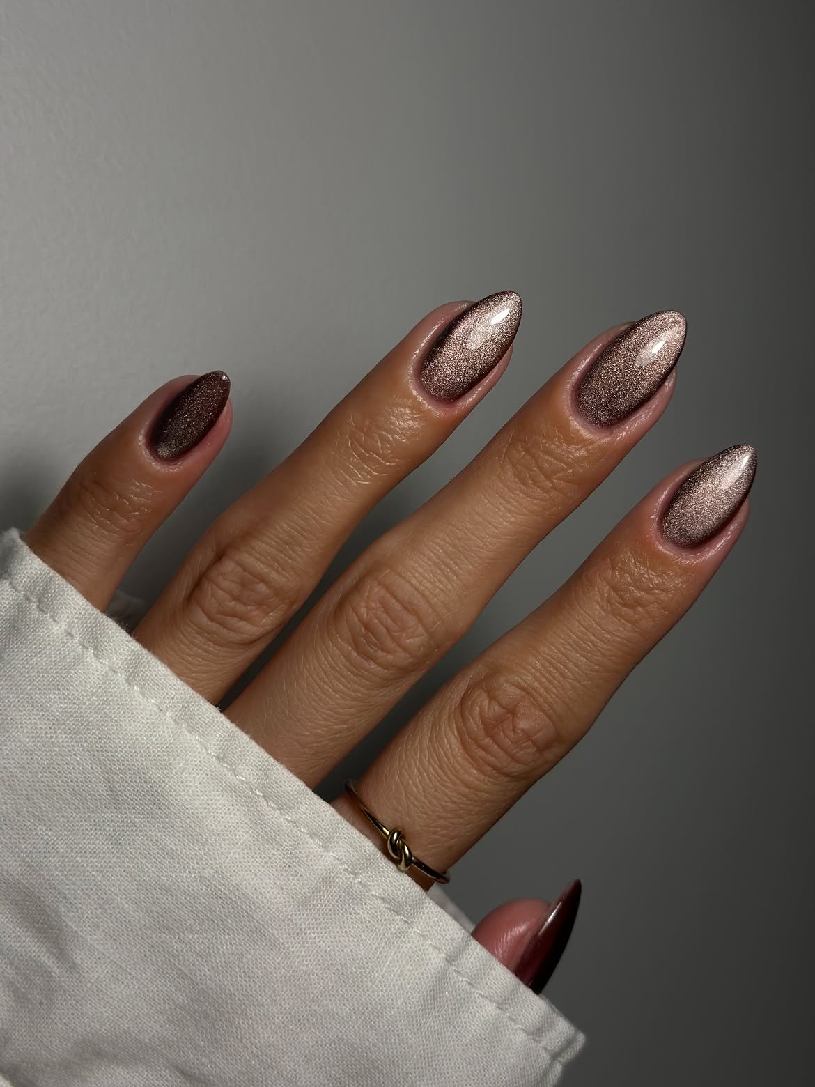 Elegant Bronze Cat Eye Almond Nails