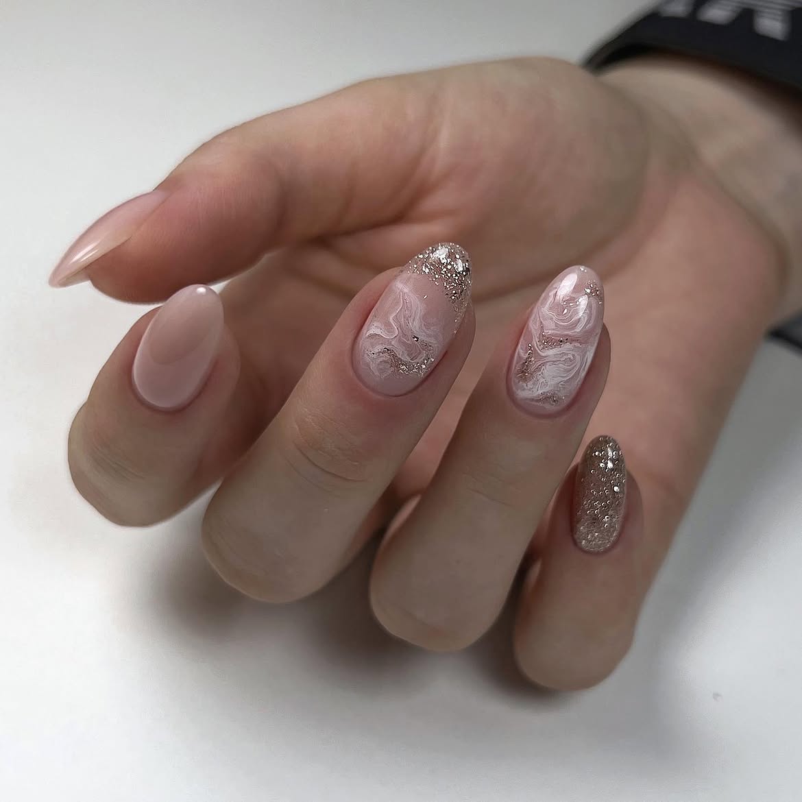 Elegant Marble Swirls and Glitter Accent Nails
