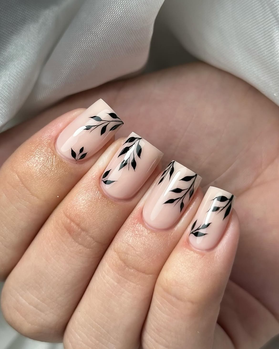 29 Stunning Fall Leaves Nail Ideas You Need To Try Now 18 Elegant Nude Nails with Black Leaf Accents