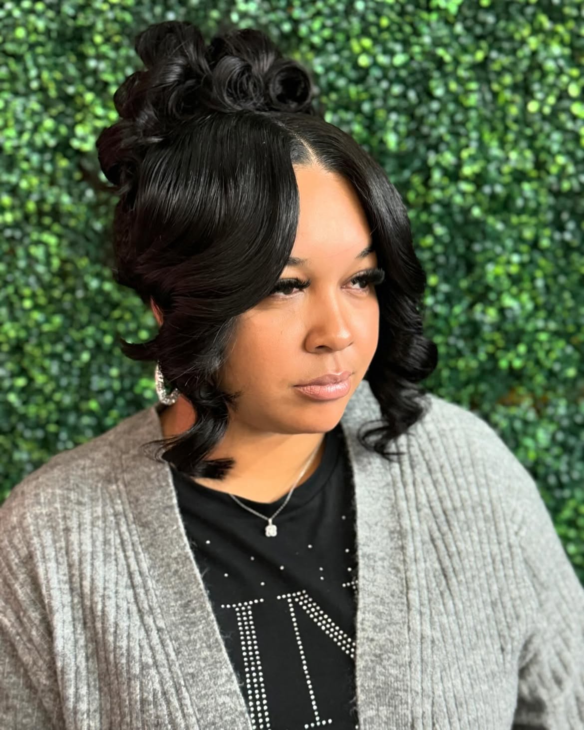 Elegant Updo With Voluminous Curls and Face-Framing