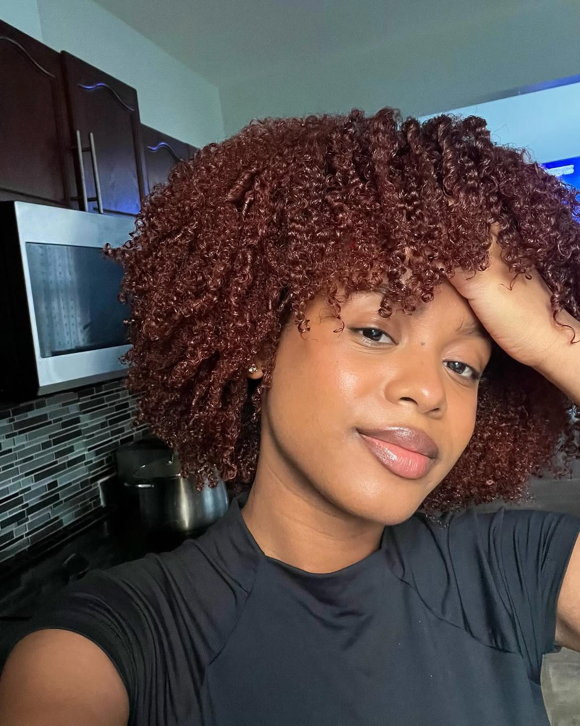 Fiery Auburn Curls With Defined Coil Pattern