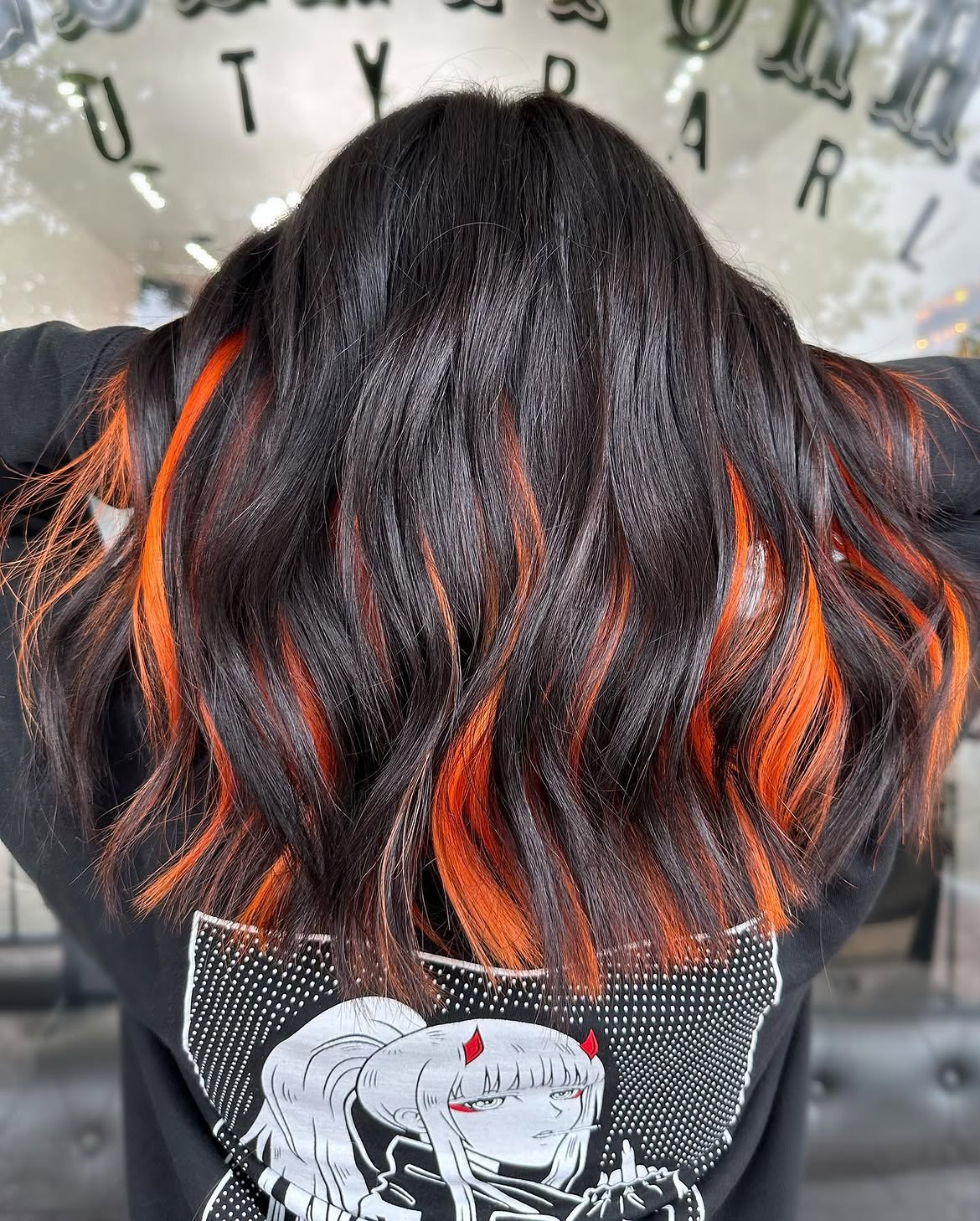 Fiery Orange Peekaboo Highlights on Dark Waves