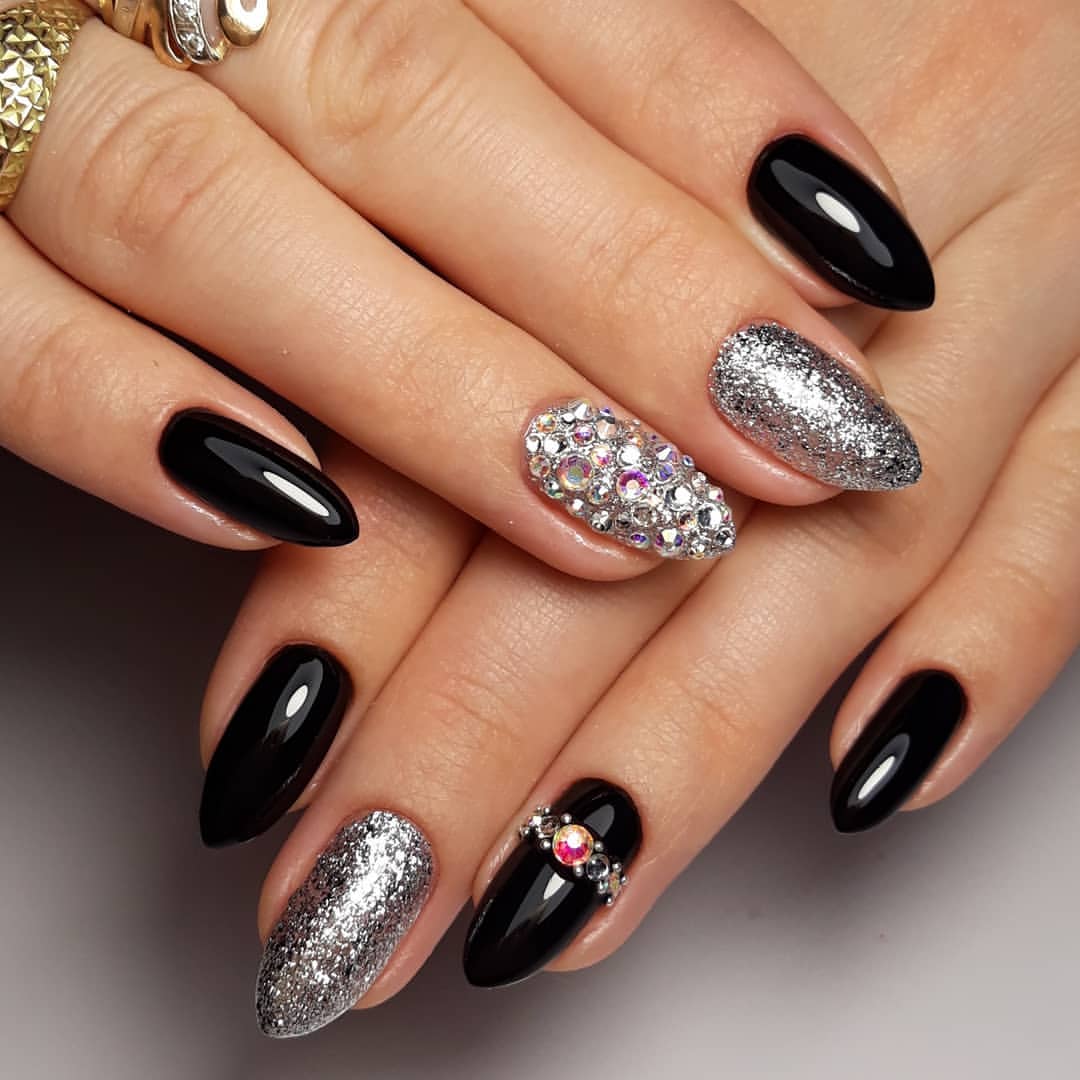 Glossy Black Almond Nails with Silver Glitter and Gems