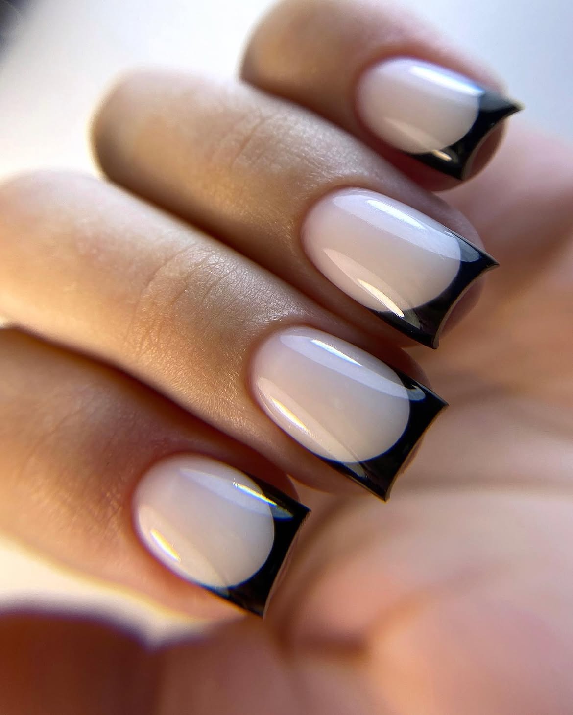 Glossy Black Arch French Tip Oval Nails