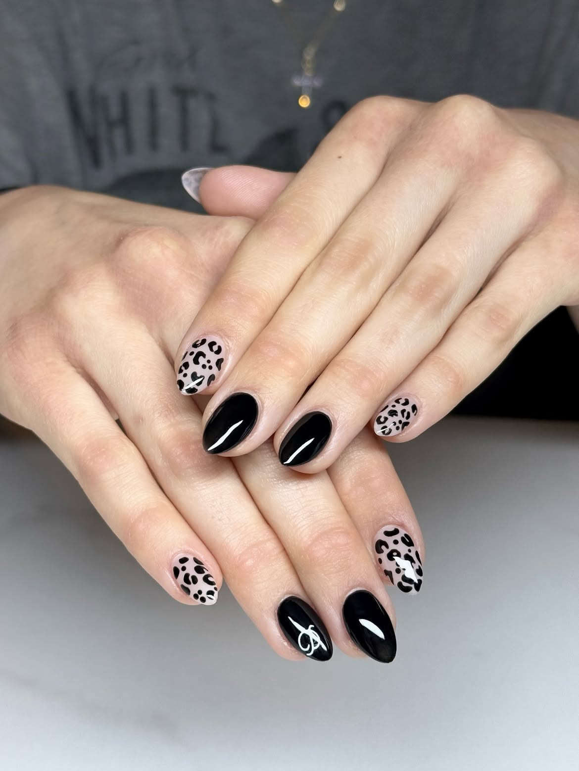 Glossy Black & Cheetah Print Almond Nails