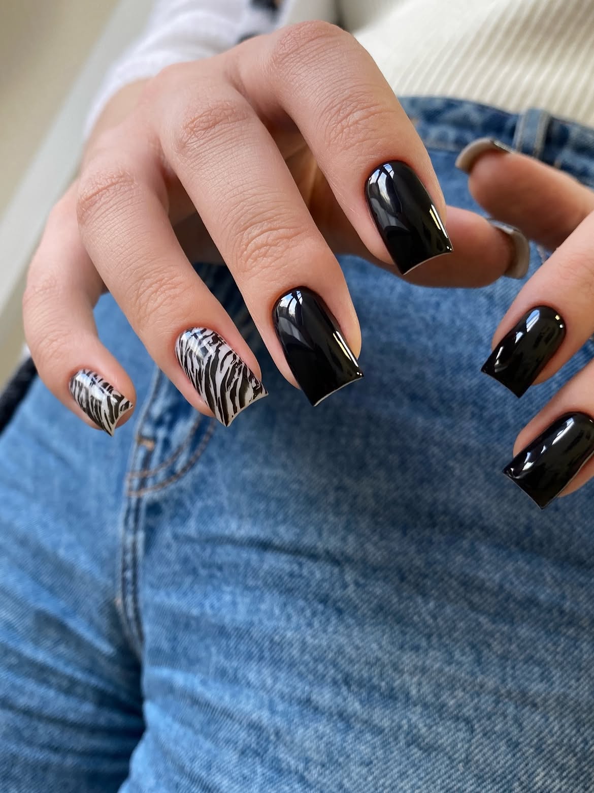 Glossy Black Square Nails With Zebra Accent