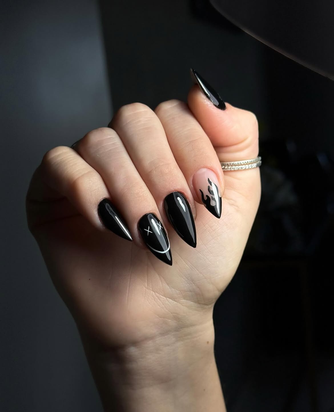 Glossy Black Stiletto Nails with Flame and Smiley Art