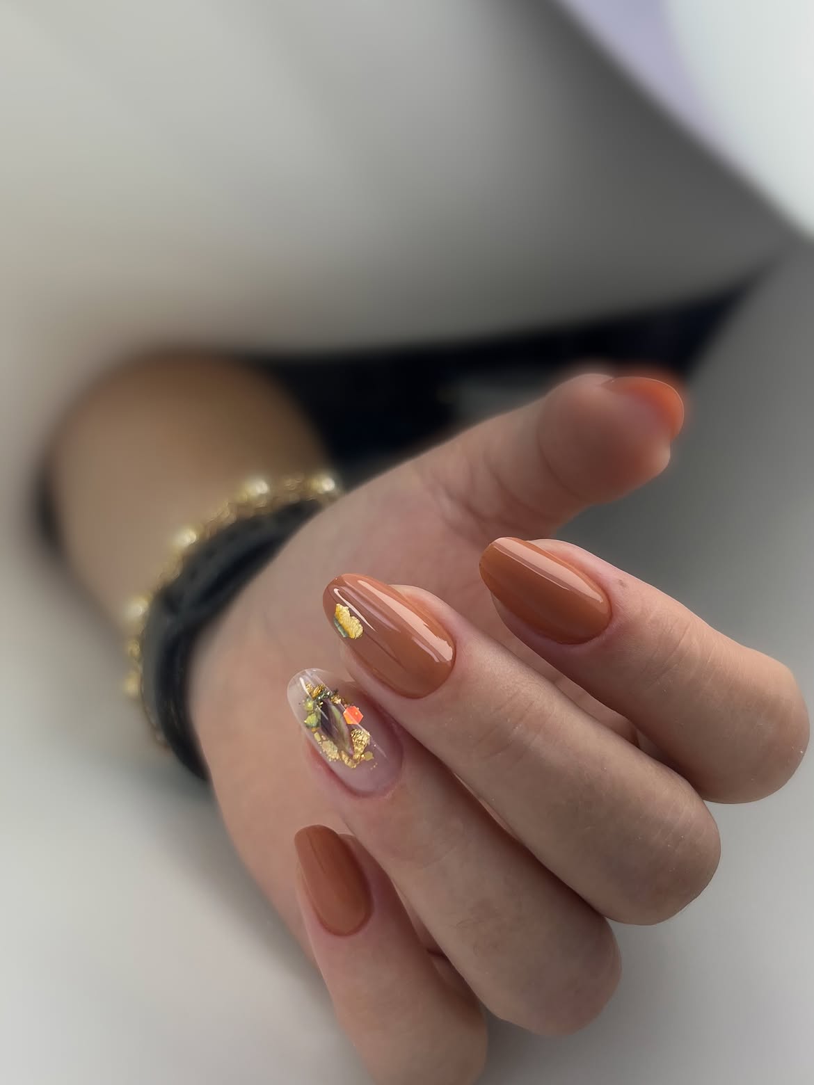 28 Stunning Orange Fall Nail Ideas You Need to Try 26 Glossy Cinnamon Almond Nails with Autumn Leaf Accent