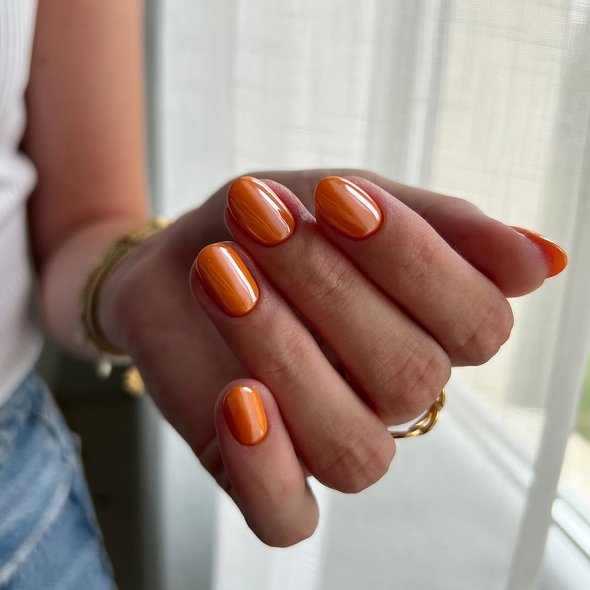 28 Stunning Orange Fall Nail Ideas You Need to Try 10 Glossy Orange Swirl Oval Nails