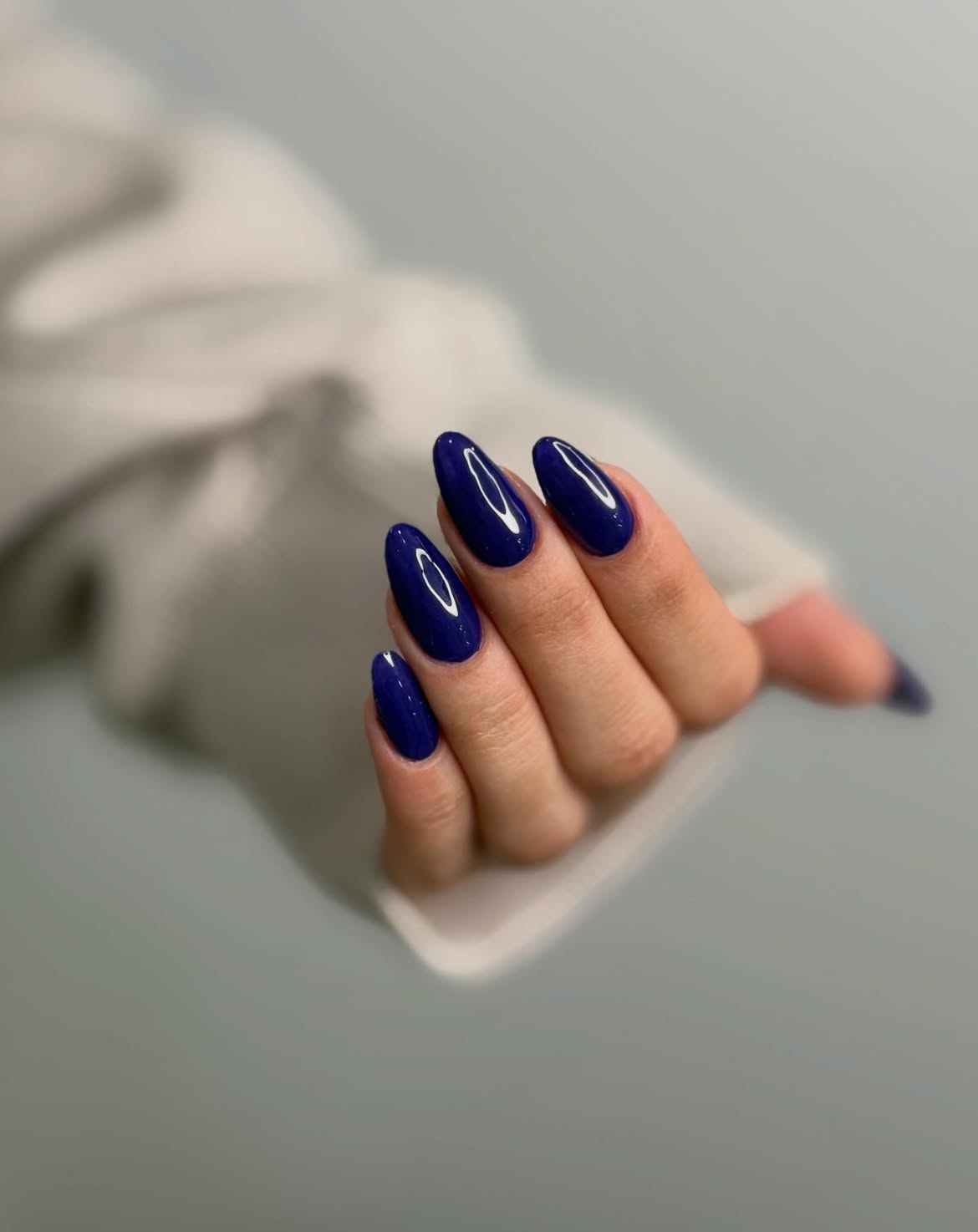 Glossy Royal Blue Almond Nails