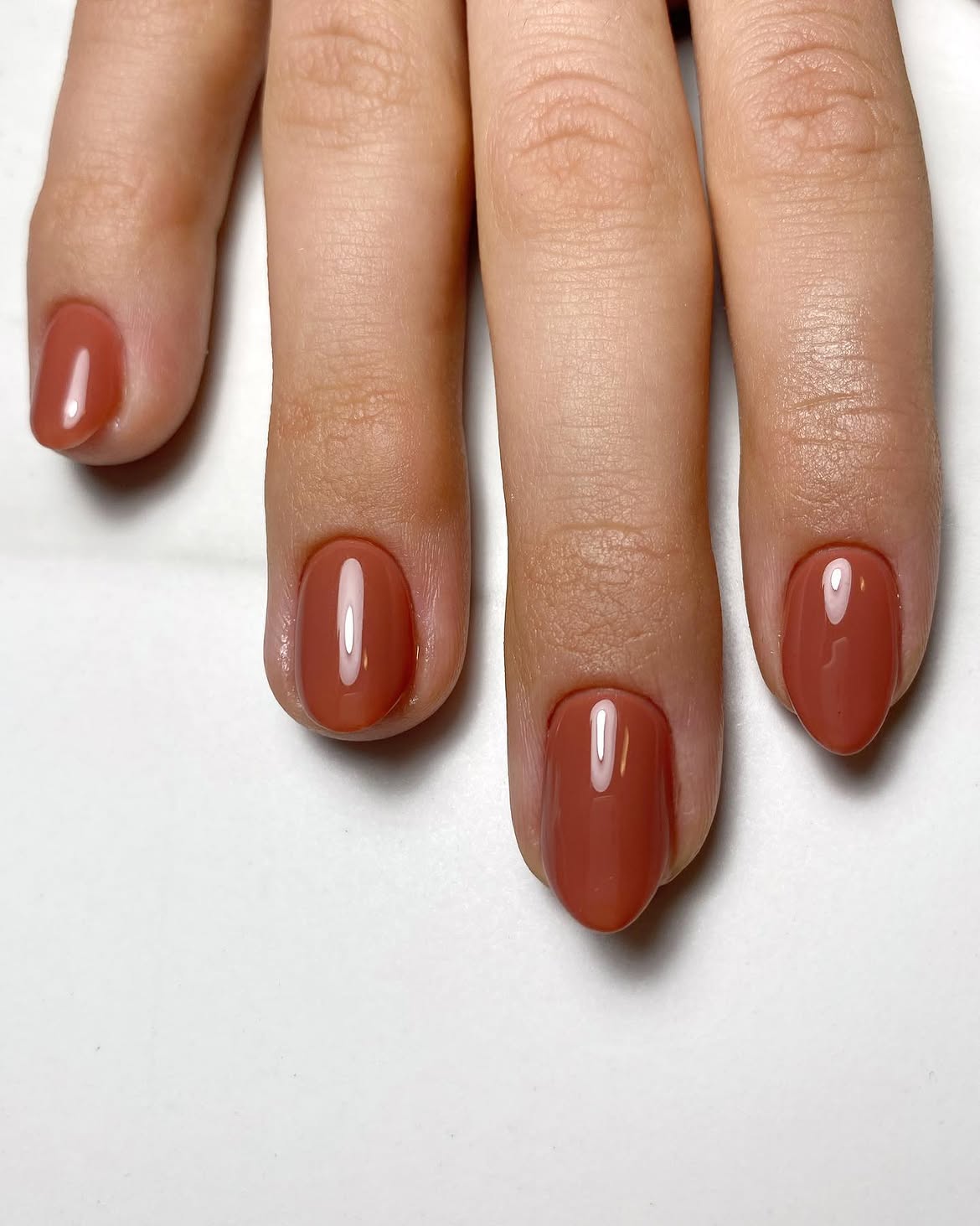 28 Stunning Orange Fall Nail Ideas You Need to Try 17 Glossy Terracotta Almond Nails