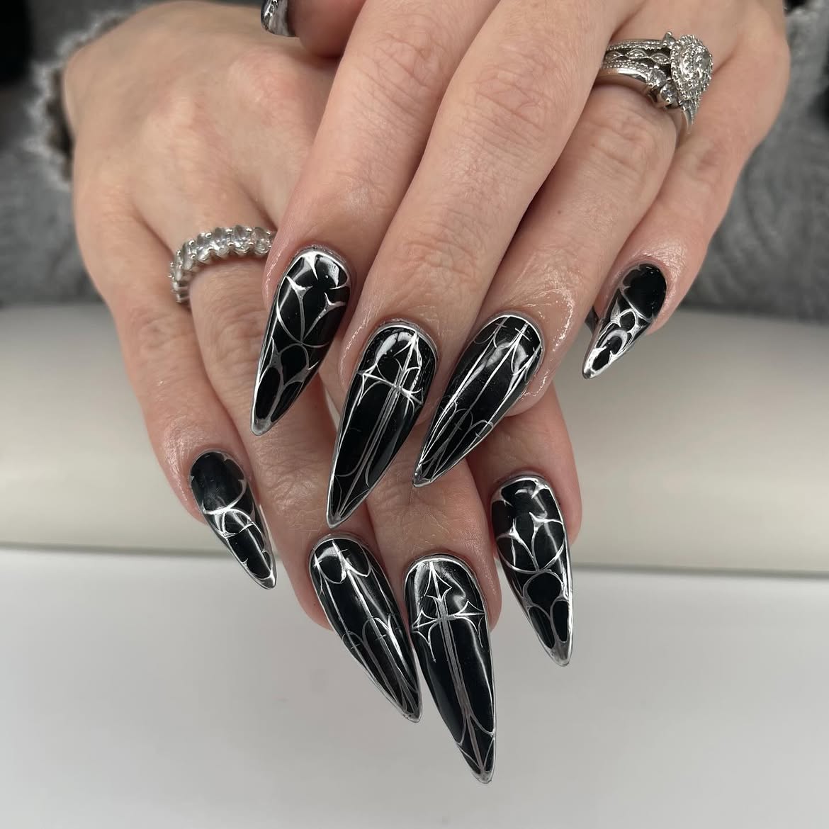 Gothic Black Stiletto Nails with Silver Chrome Accents