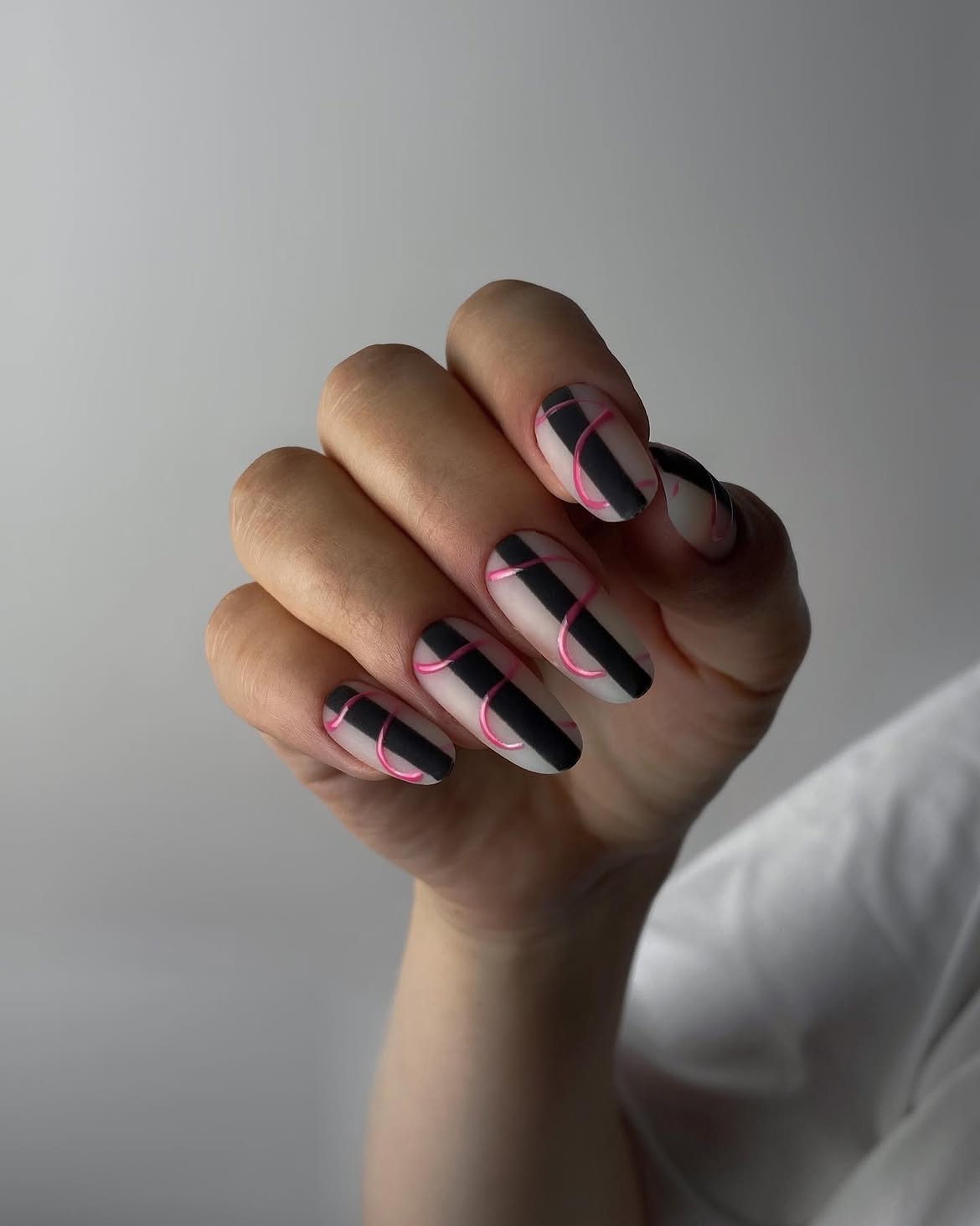 Matte Black and Pink Striped Almond Nails