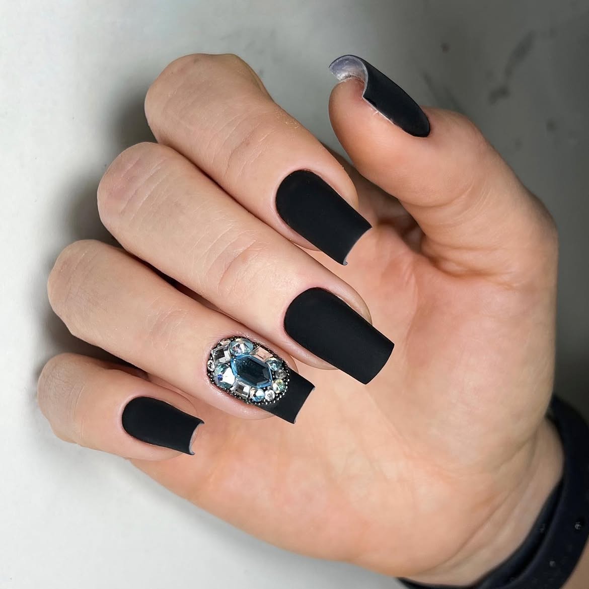 Matte Black Coffin Nails With Crystal Embellishment