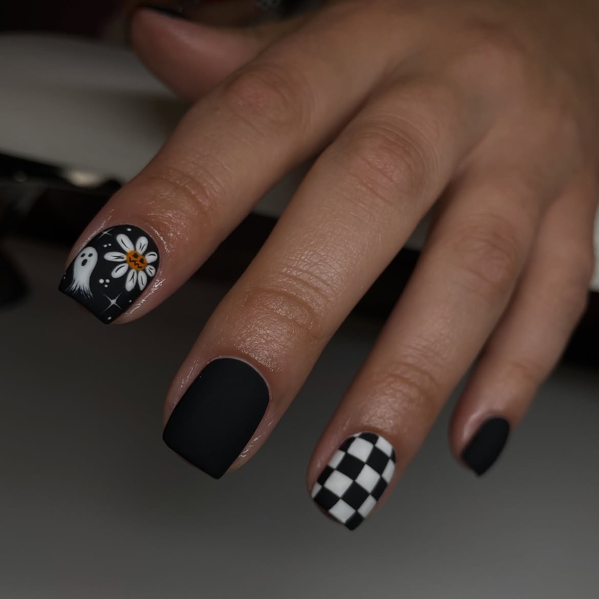 29 Spooky & Chic Halloween Nail Ideas for Short Nails 19 Matte Black Halloween Ghost Checkerboard Nails