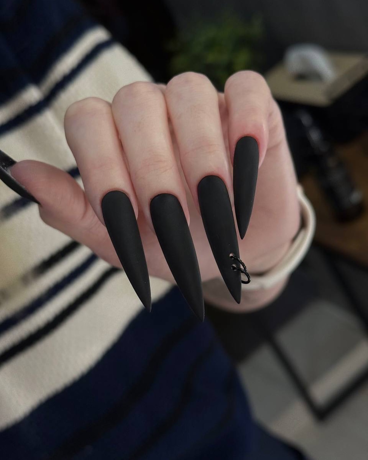Matte Black Stiletto Nails With Silver Hoop Charm