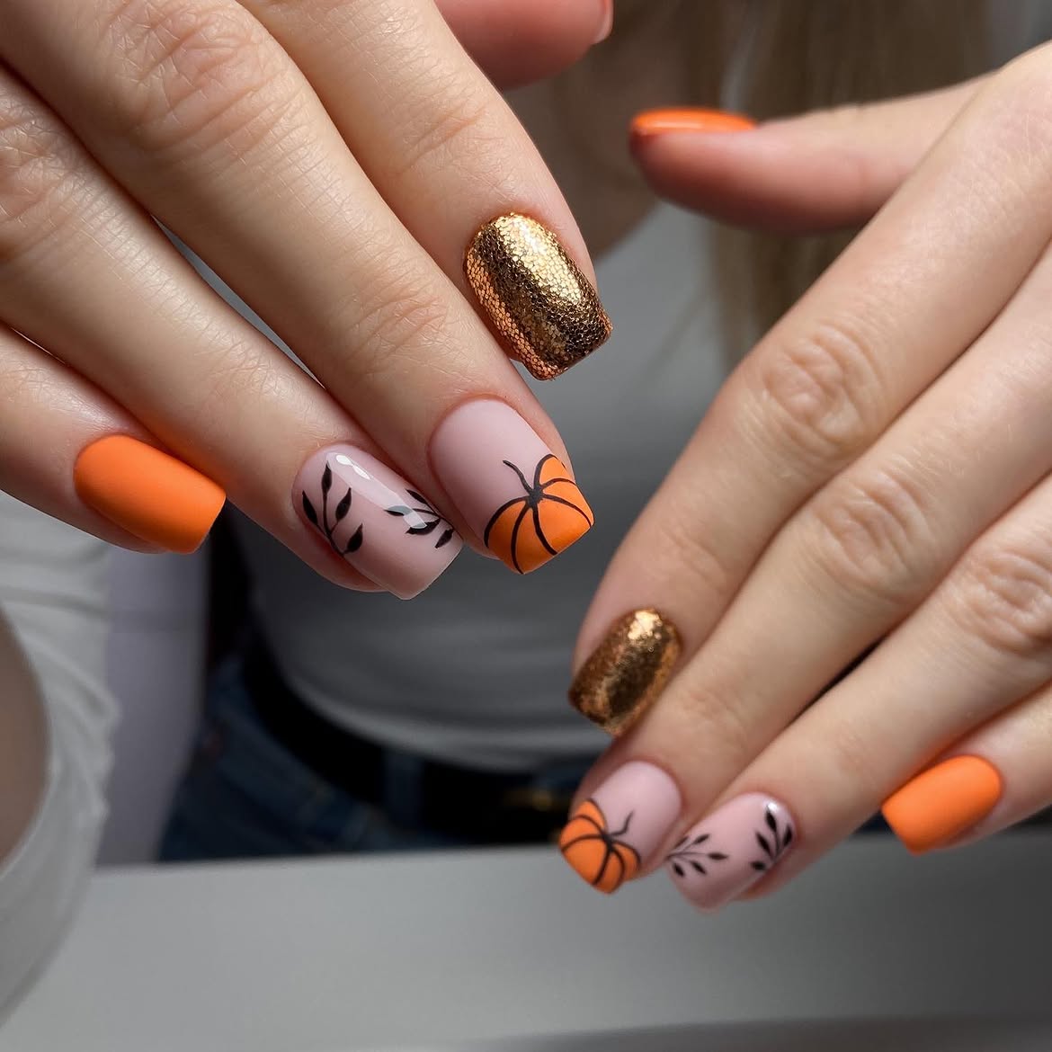 28 Stunning Pumpkin Nail Ideas for a Chic Fall Look 4 Matte Orange Pumpkin Fall Nails with Gold Accents