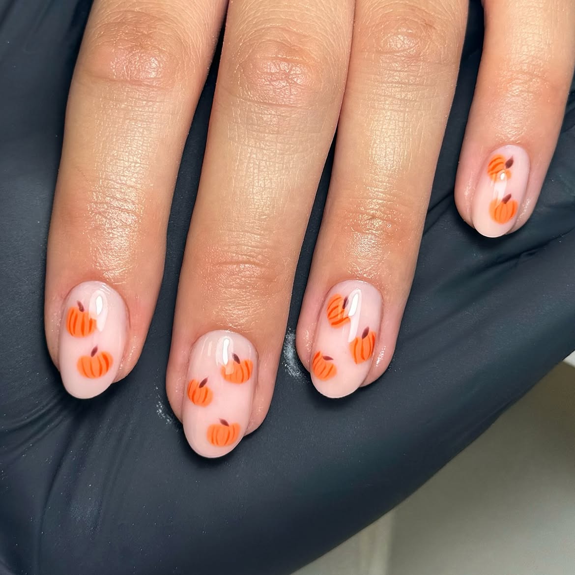 28 Stunning Pumpkin Nail Ideas for a Chic Fall Look 10 Milky Base With Cute Orange Pumpkin Accents