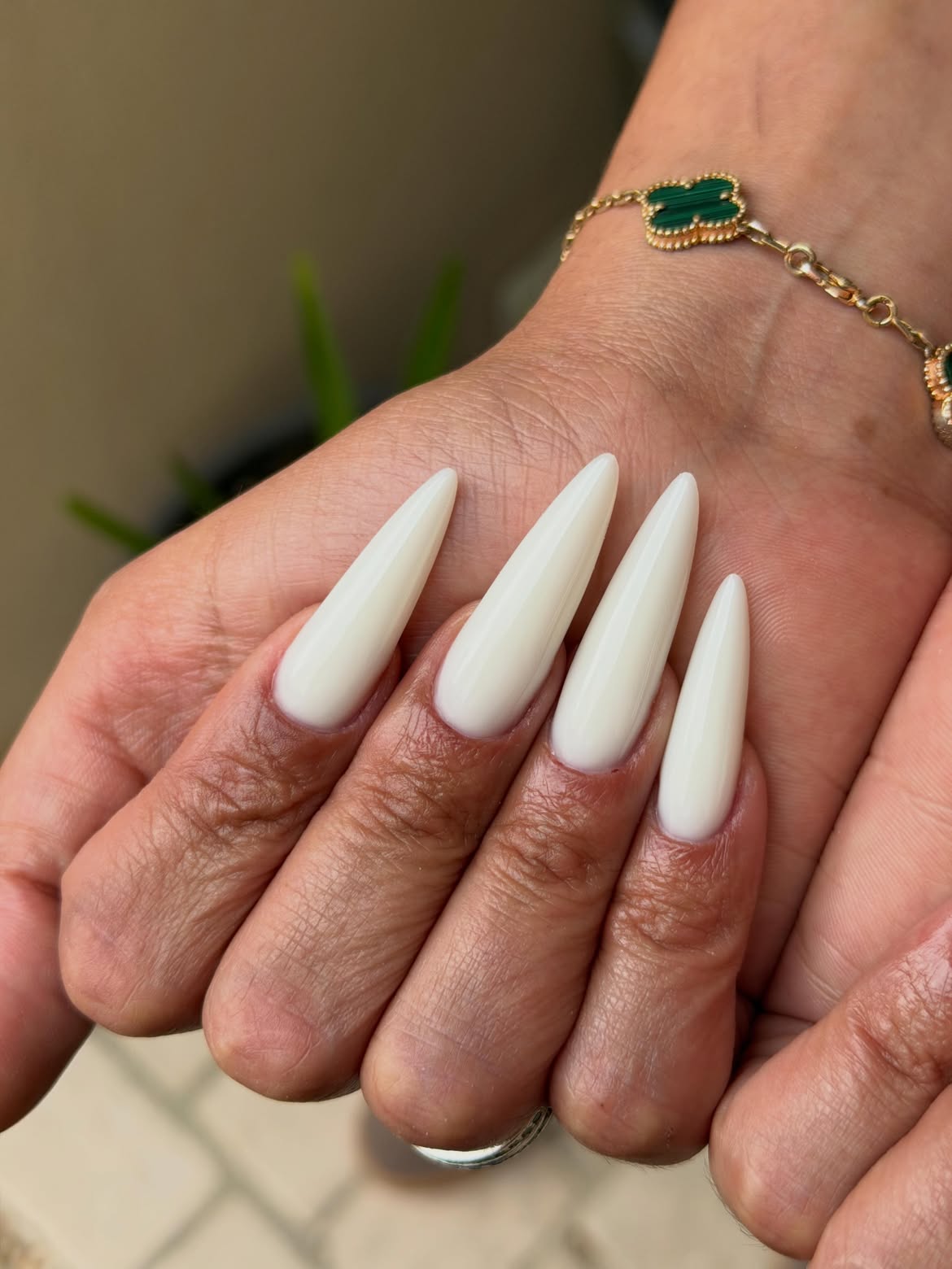 Milky White Stiletto Nails With High Gloss Finish