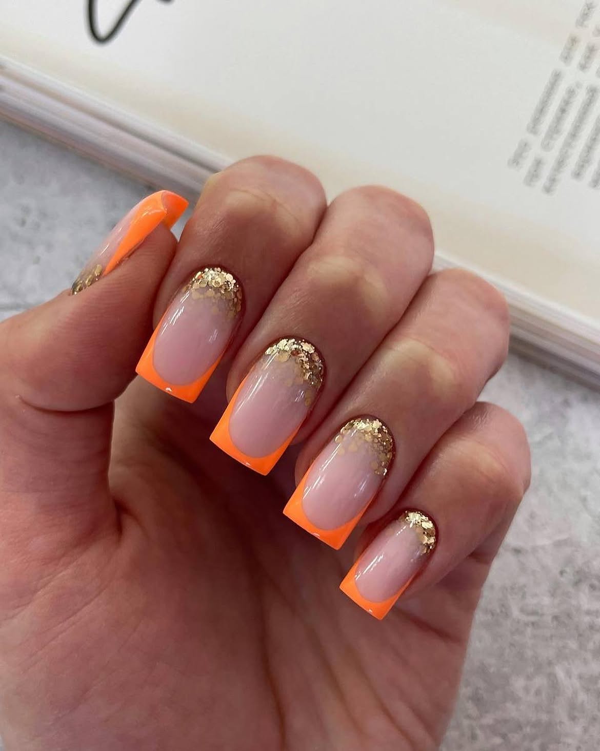 Neon Orange French Tips with Gold Glitter Accent