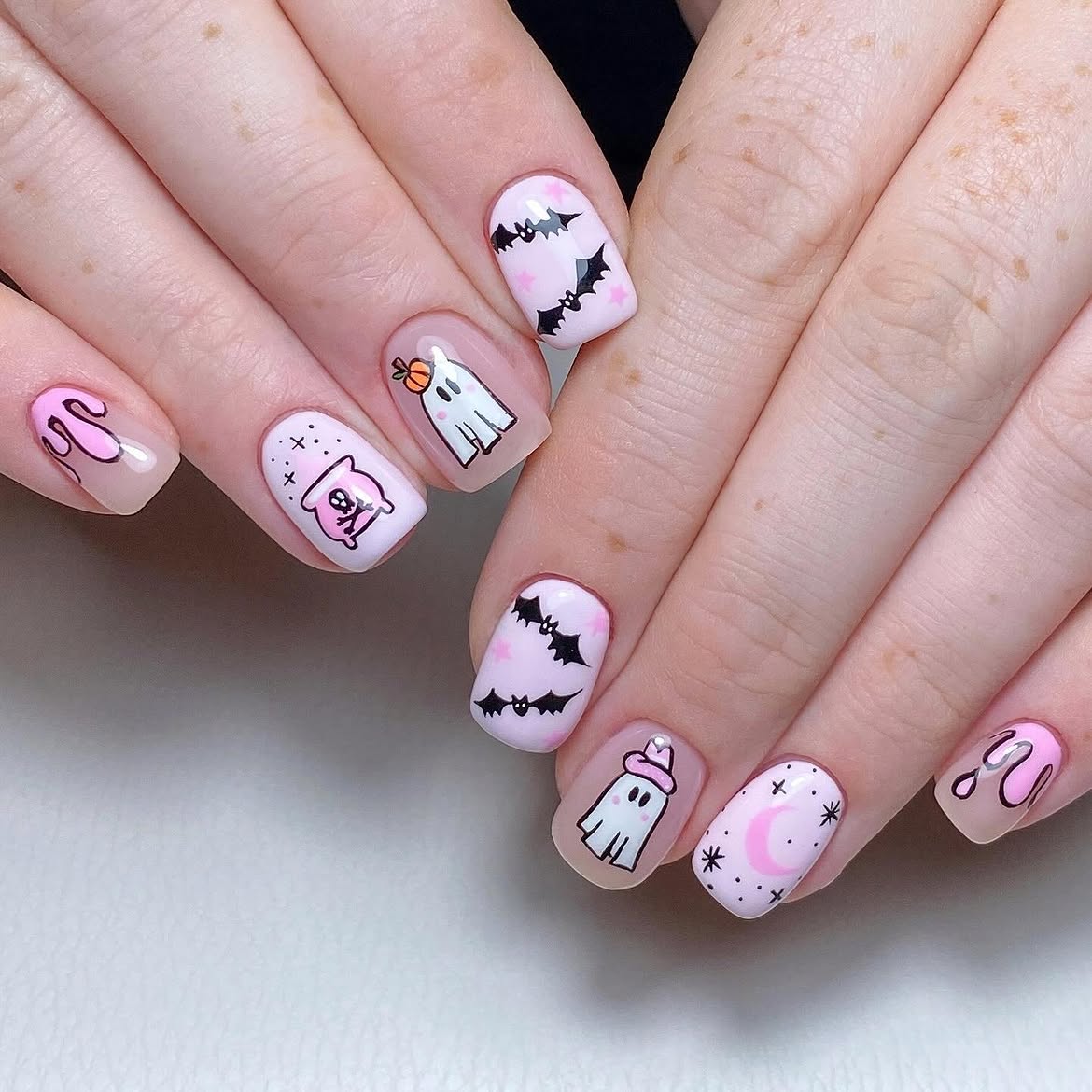 27 Spooktacular Pink Halloween Nail Ideas You Need 4 Pastel Pink Halloween Ghost & Bat Nail Art