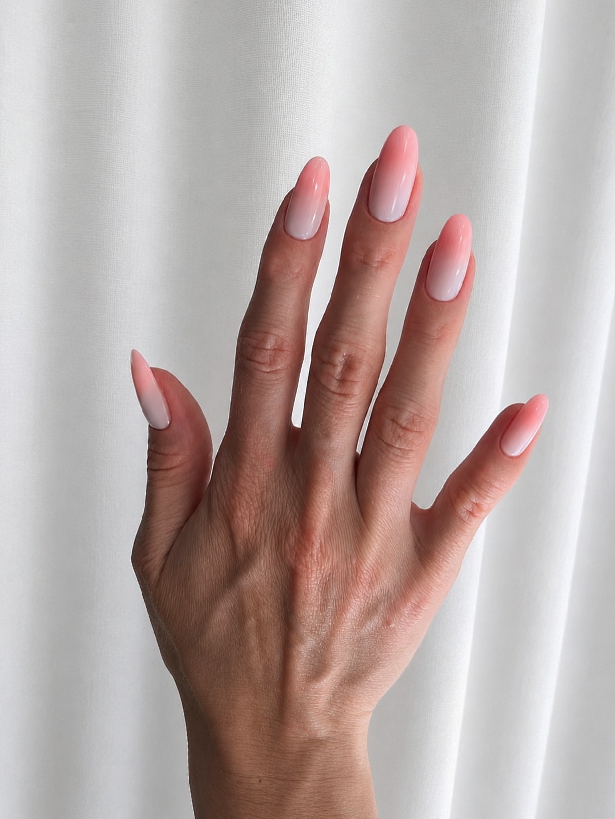 Peachy Pink Milky Ombre Almond Nails